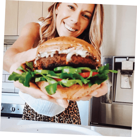 Wholefood dietitian Larina Robinson smiling with her homemade vEEF burger